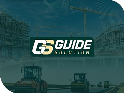 Logo Guide Solution sur fond de chantier : grues, bâtiments en construction et compacteurs sur une route